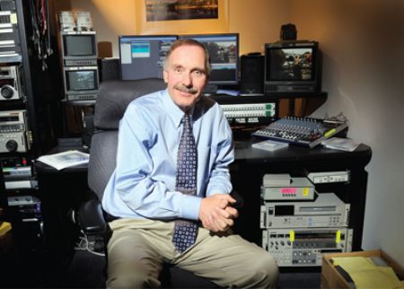 He is posing for a photo.